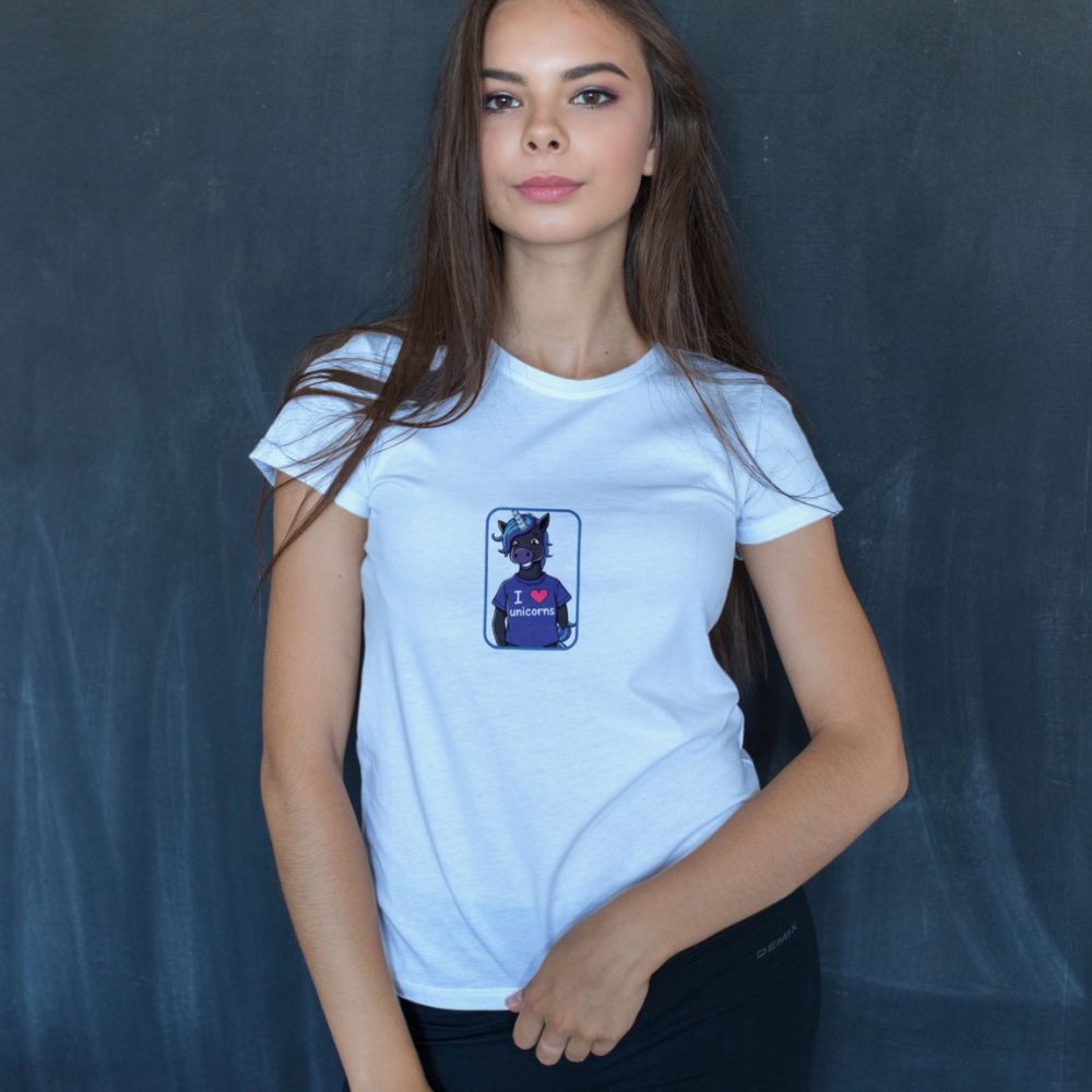Woman wearing a white t-shirt with a graphic design against a dark background