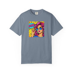 Gray t-shirt with a colorful graphic of a woman with pink hair and sunglasses on a white background