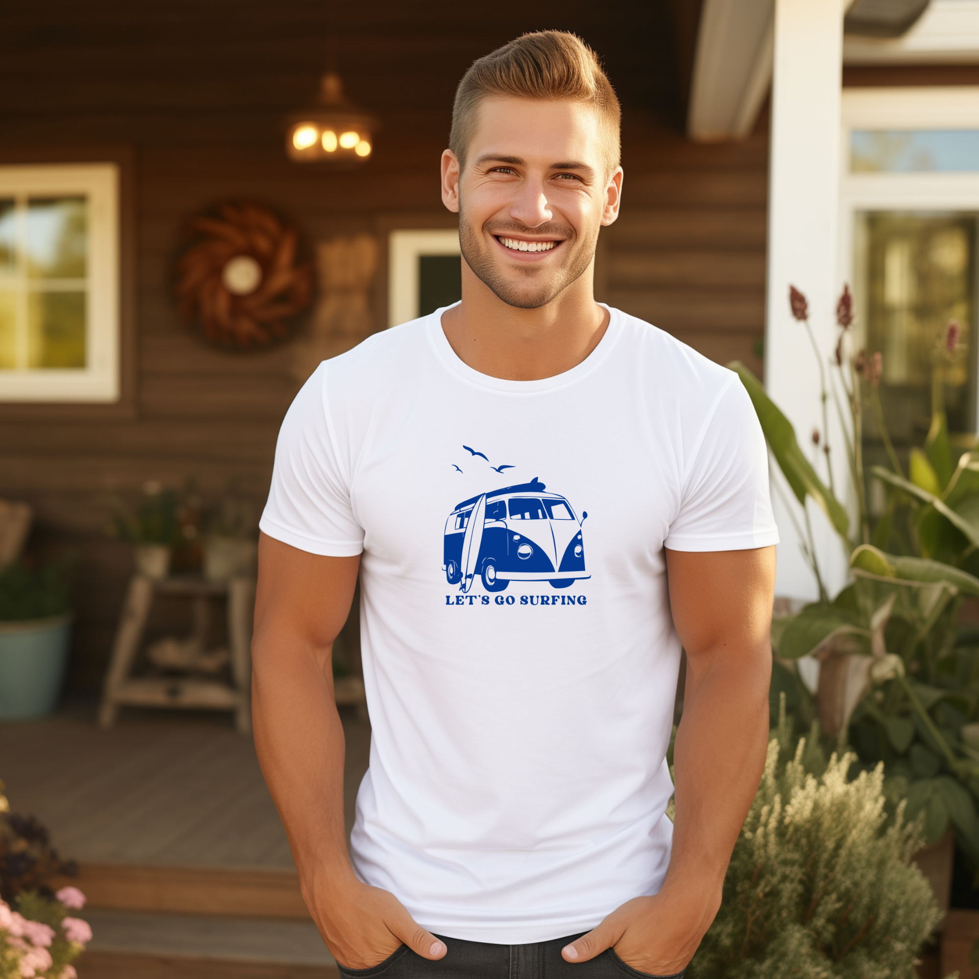 Man wearing a white t-shirt with a blue graphic and text, standing outdoors.