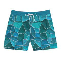 Blue mosaic patterned shorts on a white background