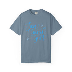 Blue t-shirt with 'Sea Sand Salt' text on a white background