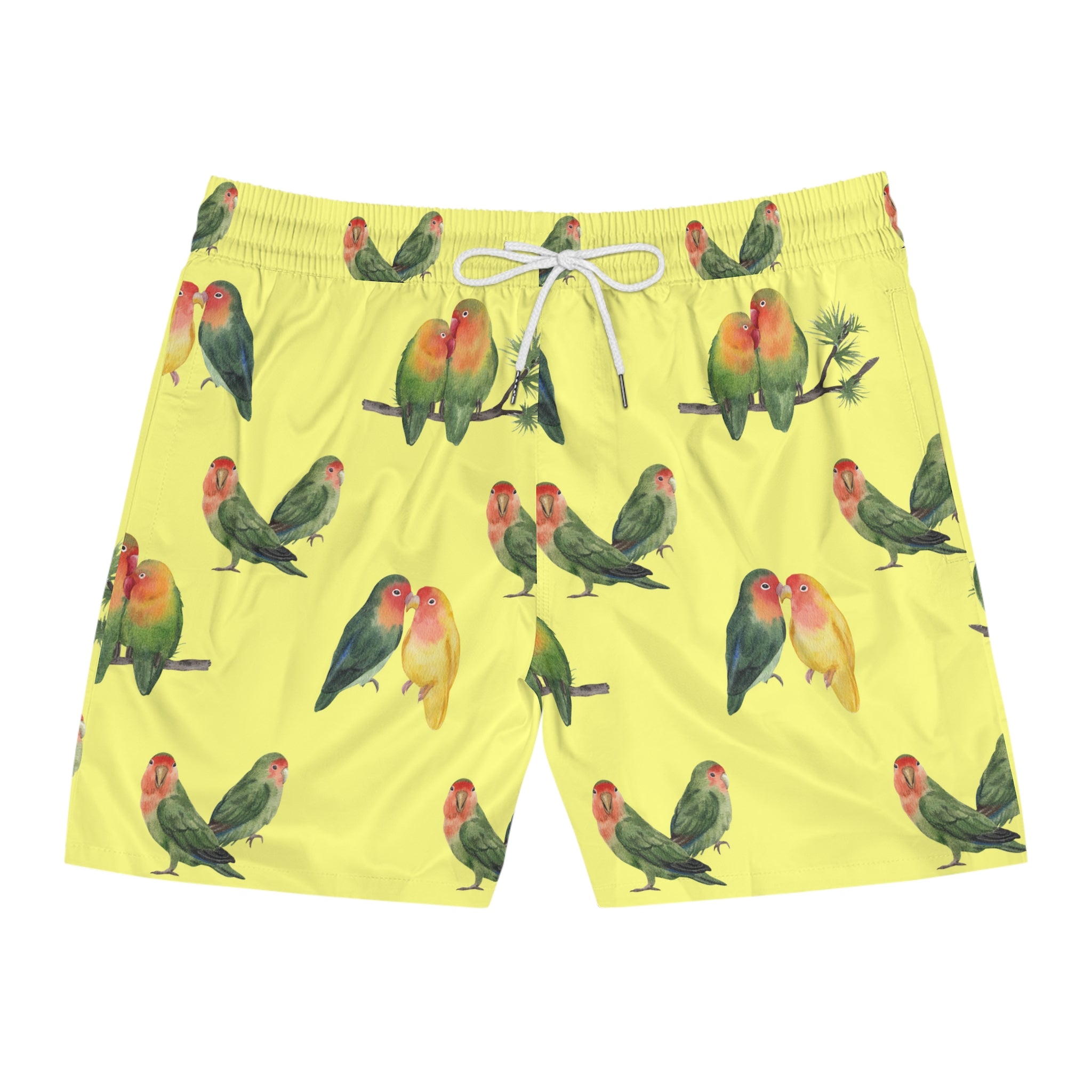 Yellow swim shorts with parrot pattern on a white background