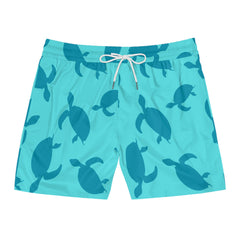 Turquoise swim shorts with turtle pattern on a white background