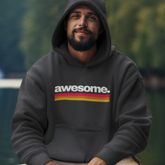 Man wearing a hoodie with 'awesome' printed on it, sitting outdoors with a blurred natural background