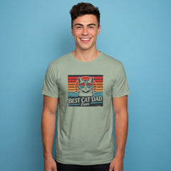 Man wearing a green t-shirt with a cat graphic and text on a blue background