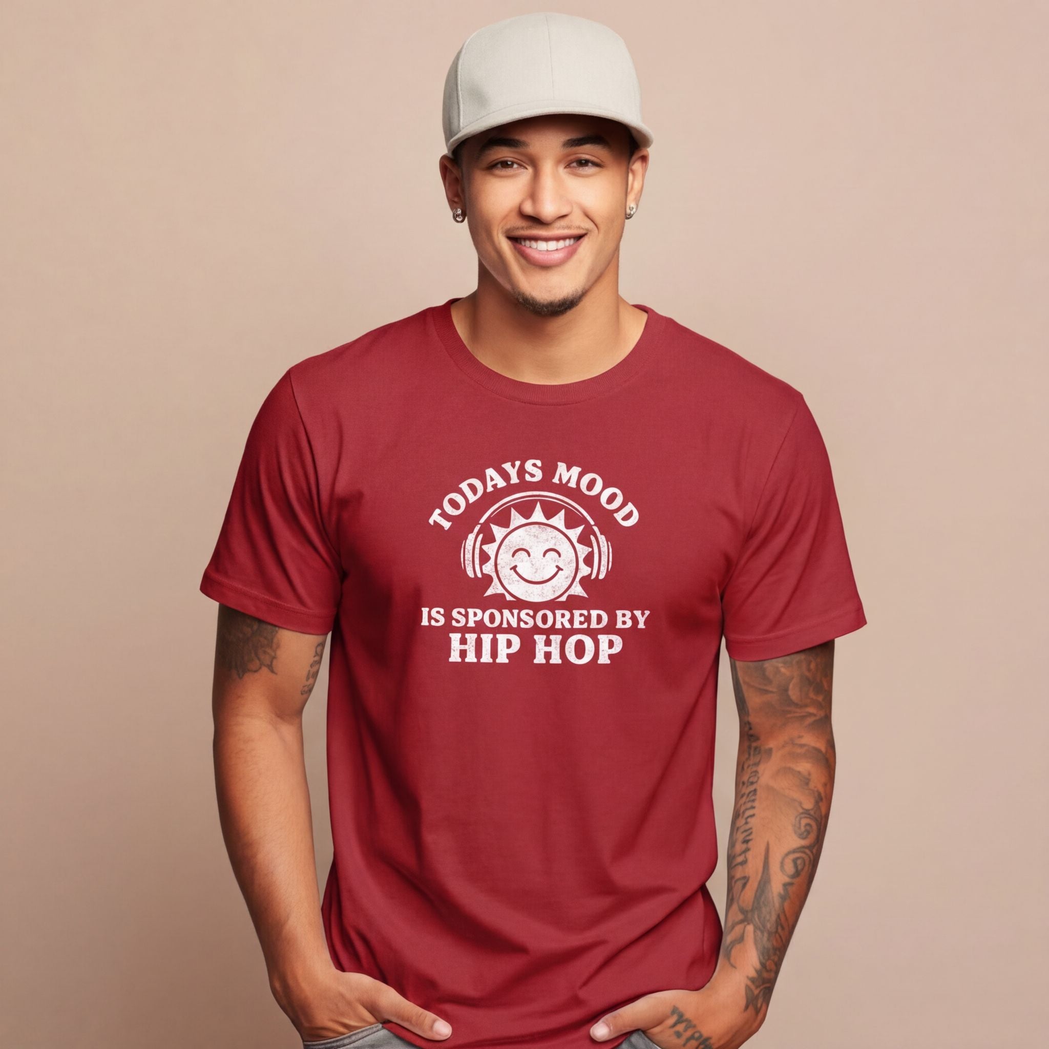 Man wearing a red t-shirt with a humorous graphic and text on a beige background