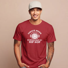 Man wearing a red t-shirt with a humorous graphic and text on a beige background