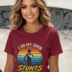 Woman wearing a t-shirt with 'I do my own stunts' graphic at a skate park.