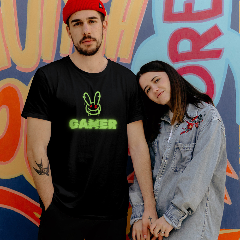 Two people standing together in front of a colorful mural.