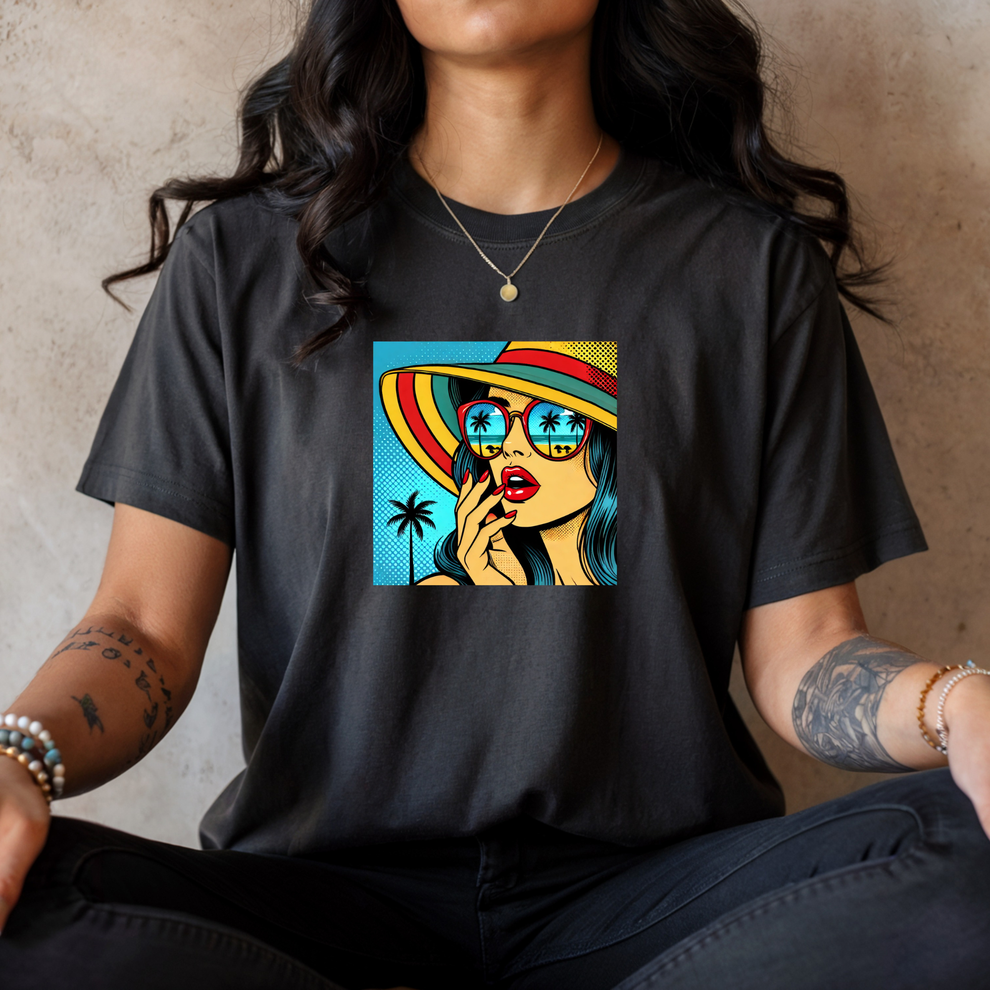 Person wearing a black t-shirt with a colorful graphic design on a neutral background