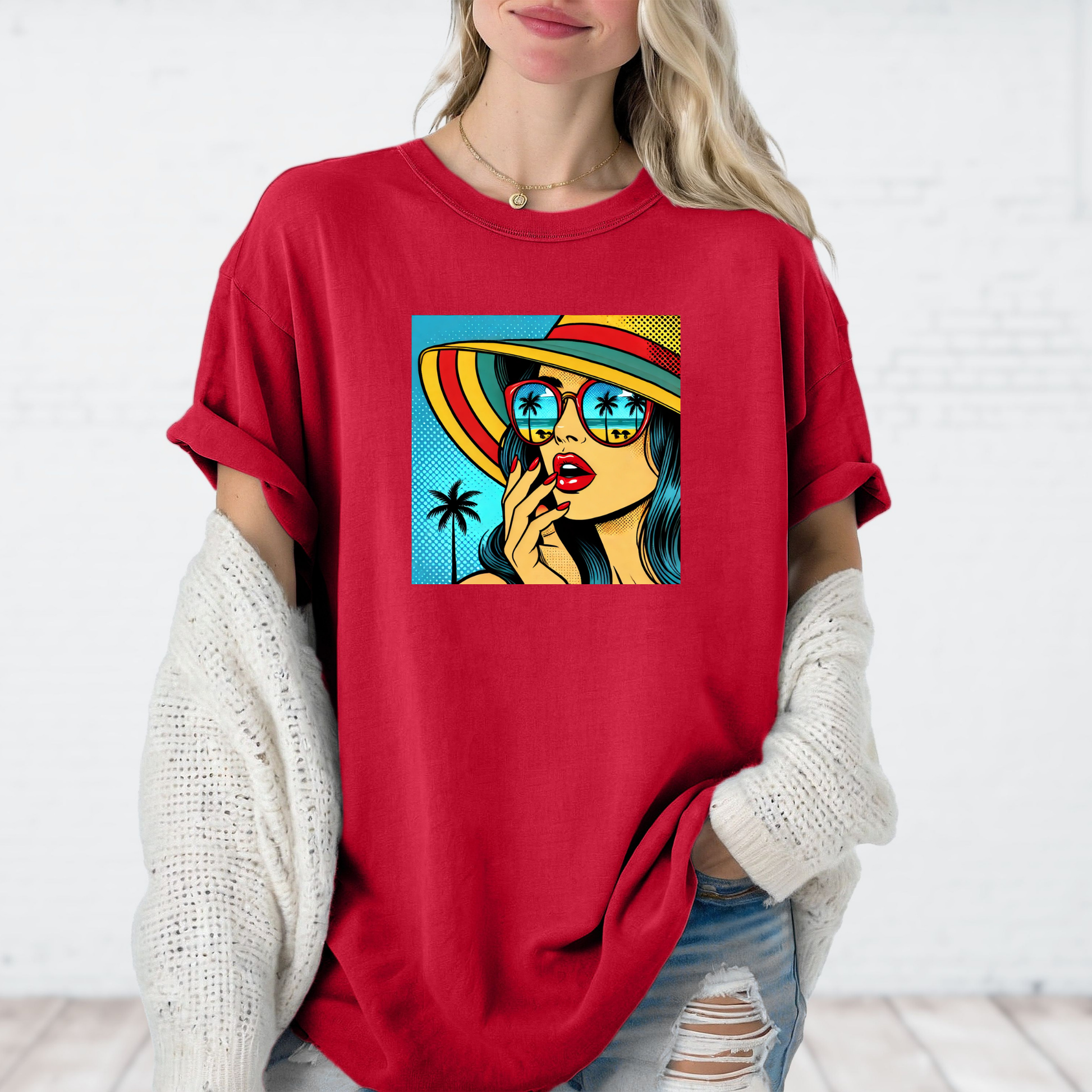 Person wearing a red t-shirt with a colorful graphic design on a white background