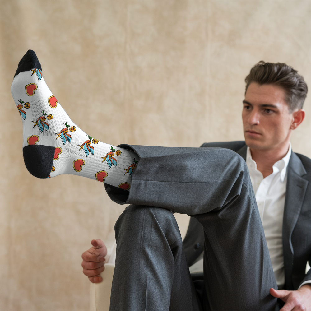 Man in a suit with a sock featuring colorful designs on a beige background