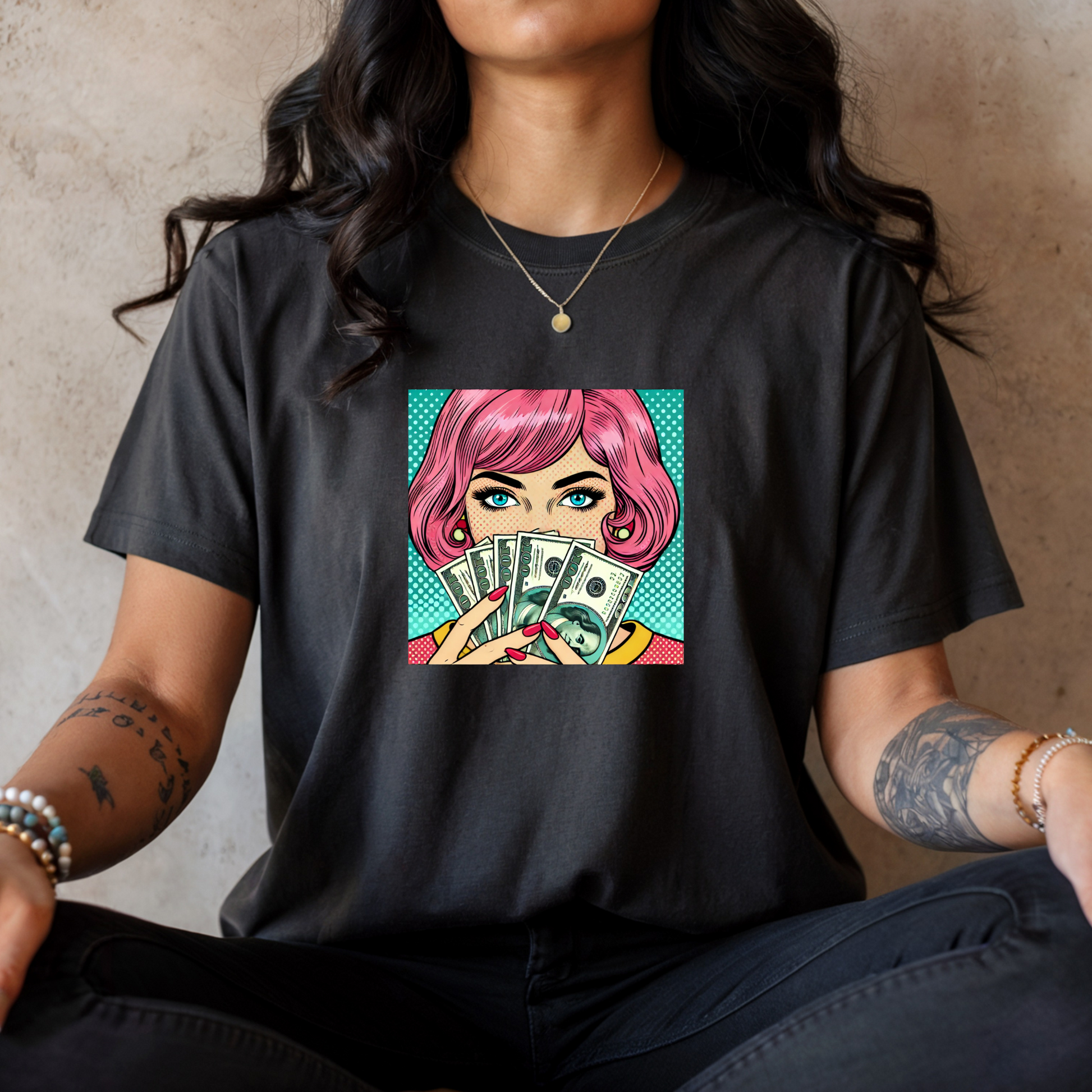 Person wearing a black t-shirt with a colorful graphic design on a neutral background