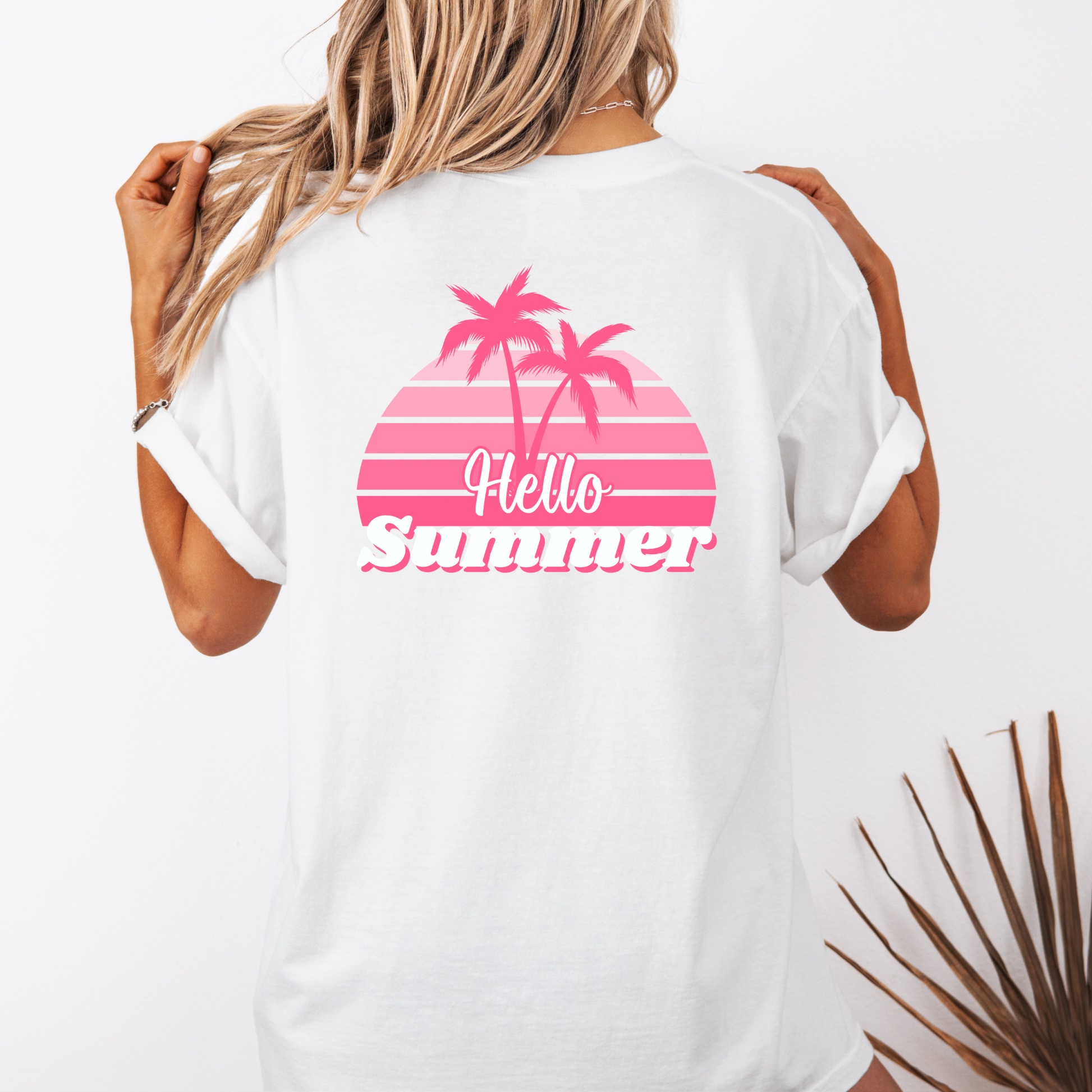 White t-shirt with 'Hello Summer' design featuring pink palm trees on a white background