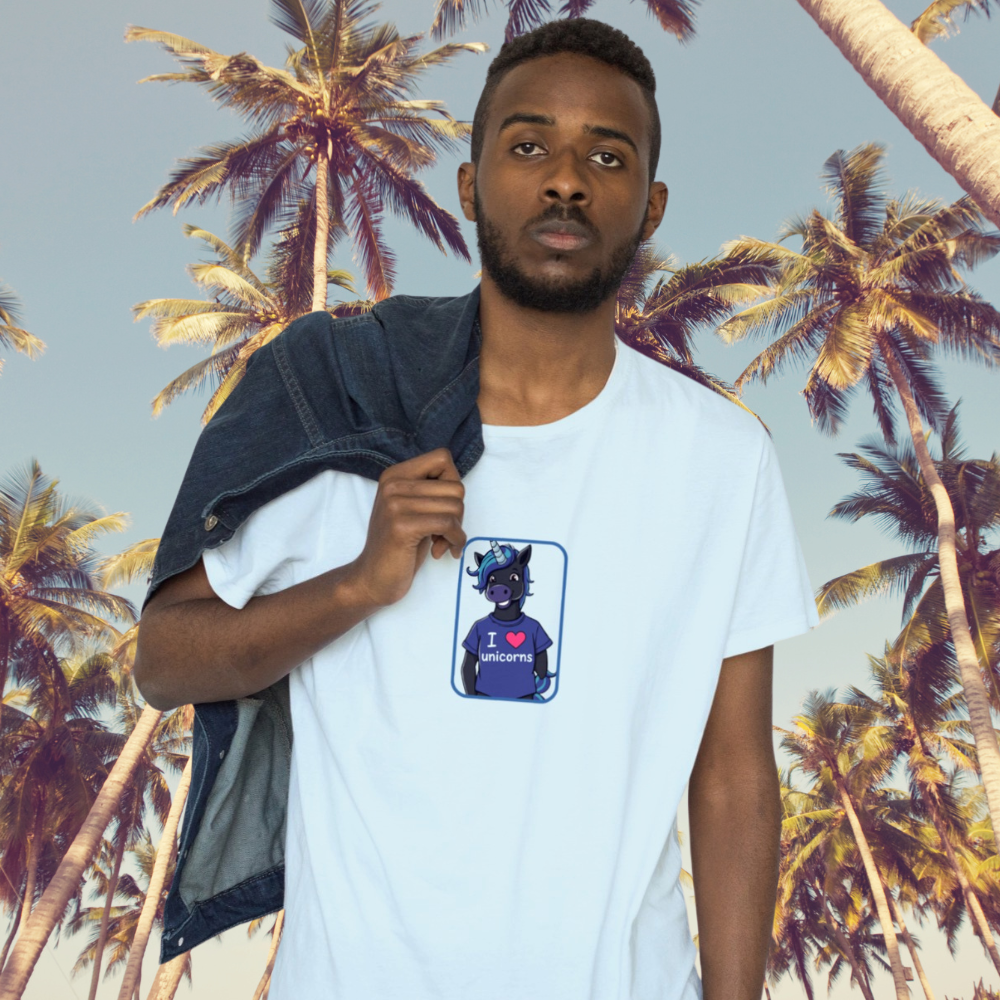 Man wearing a white t-shirt with a graphic design in front of palm trees