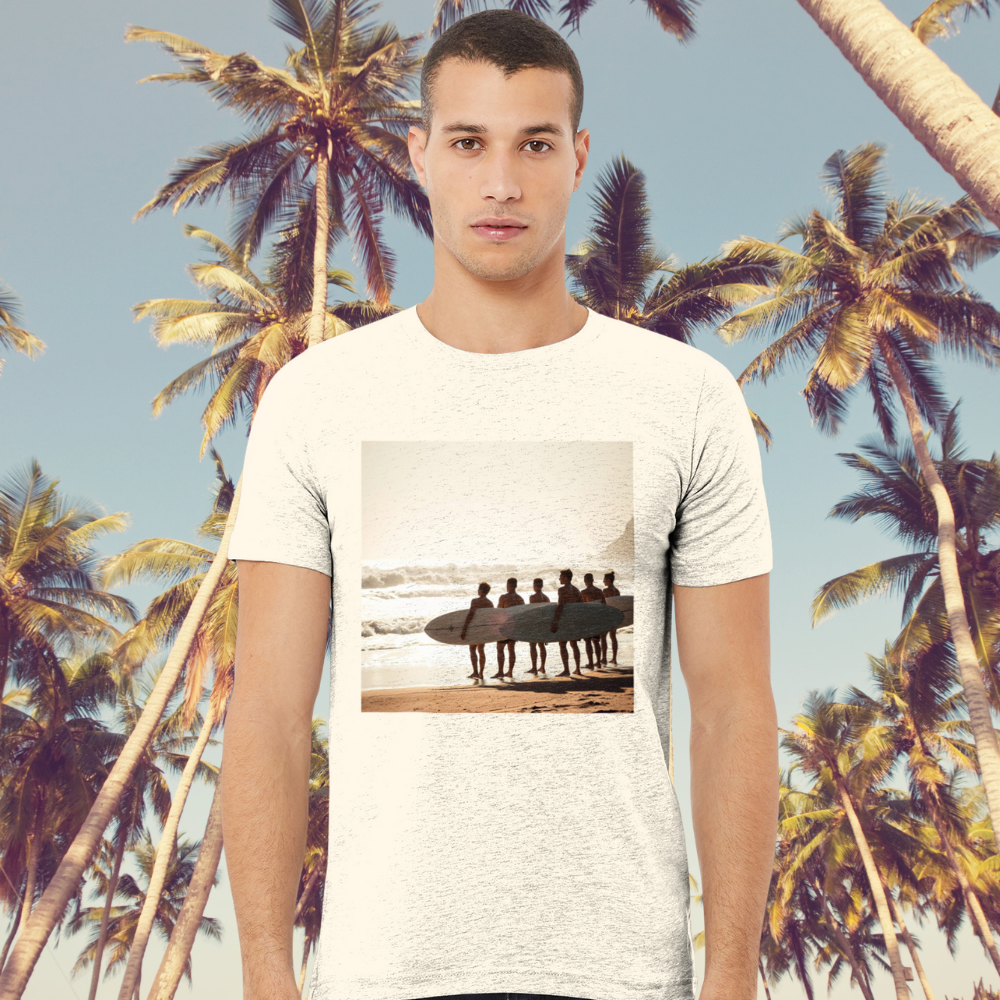 A man at the beach wearing a vintage surf t-shirt