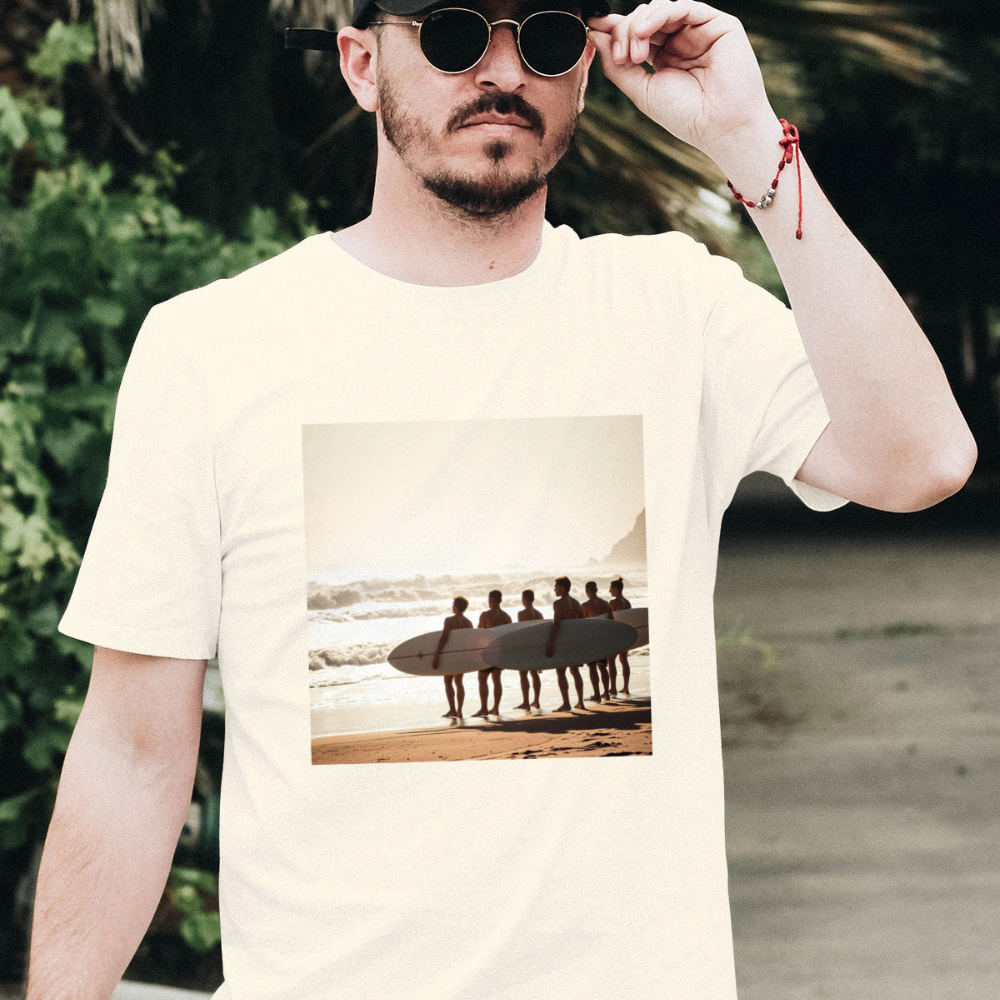 A man with sunglasses wearing a vintage surf t-shirt