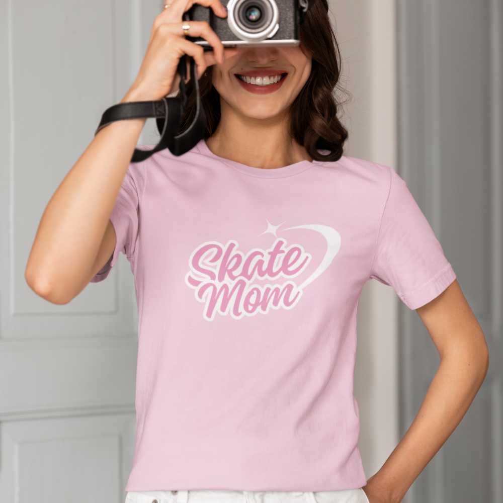 Person wearing a pink 'Skate Mom' t-shirt holding a camera.