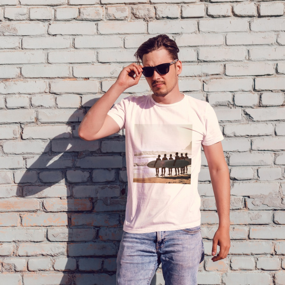 A man posing, wearing a vintage surf shirt