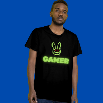 Person wearing a black t-shirt with a green graphic and text on a blue background