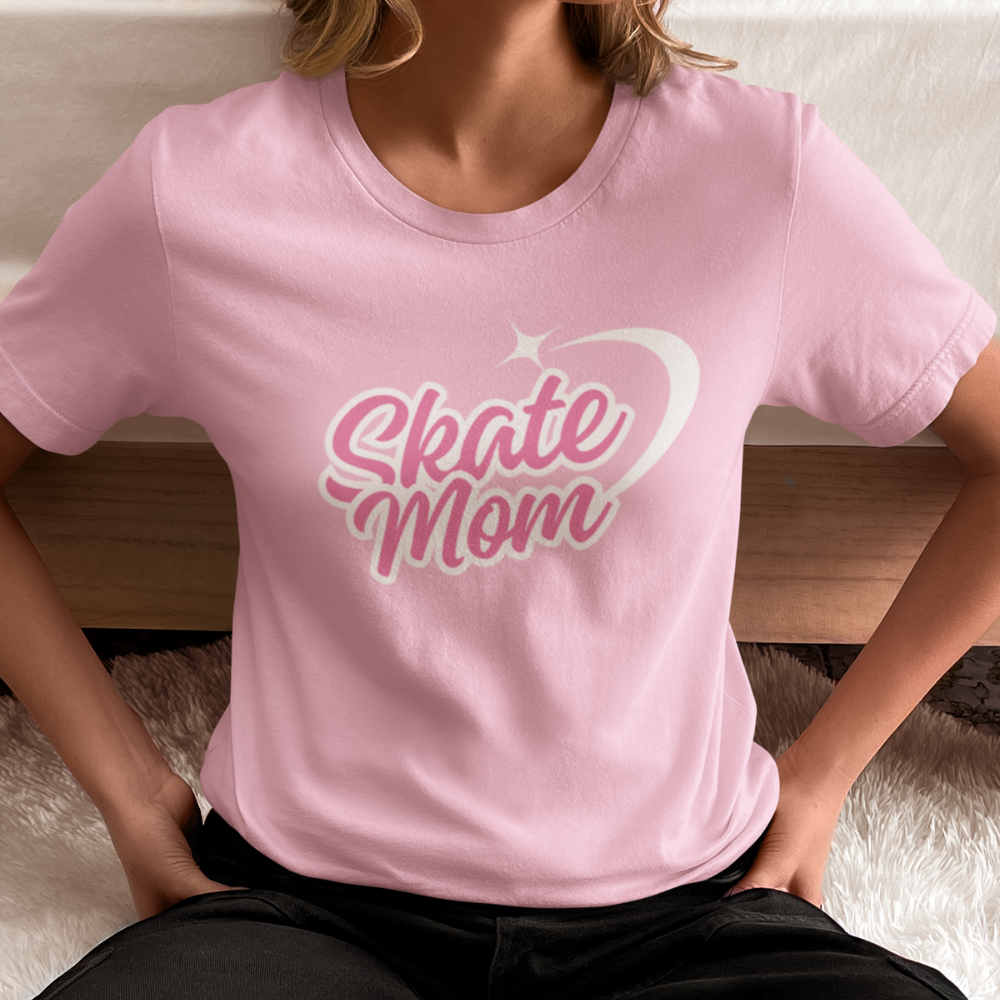 Person wearing a pink t-shirt with 'Skate Mom' text.