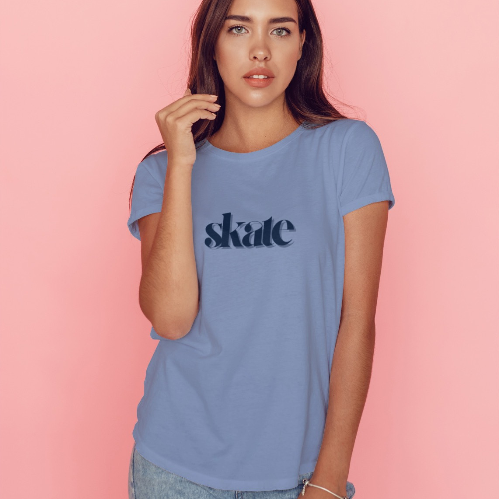 Woman wearing a blue t-shirt with 'skate' text on a pink background