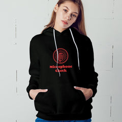 Person wearing a black hoodie with a red microphone graphic and text against a white background