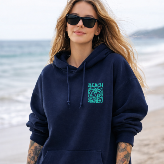 Model wearing Beach Vibes hoodie in Navy at the beach