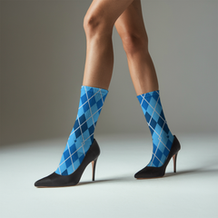 Blue argyle knee-high socks worn with black high heels on a neutral background
