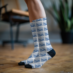 Person wearing socks with a blue and white pattern of boom boxes in an indoor setting