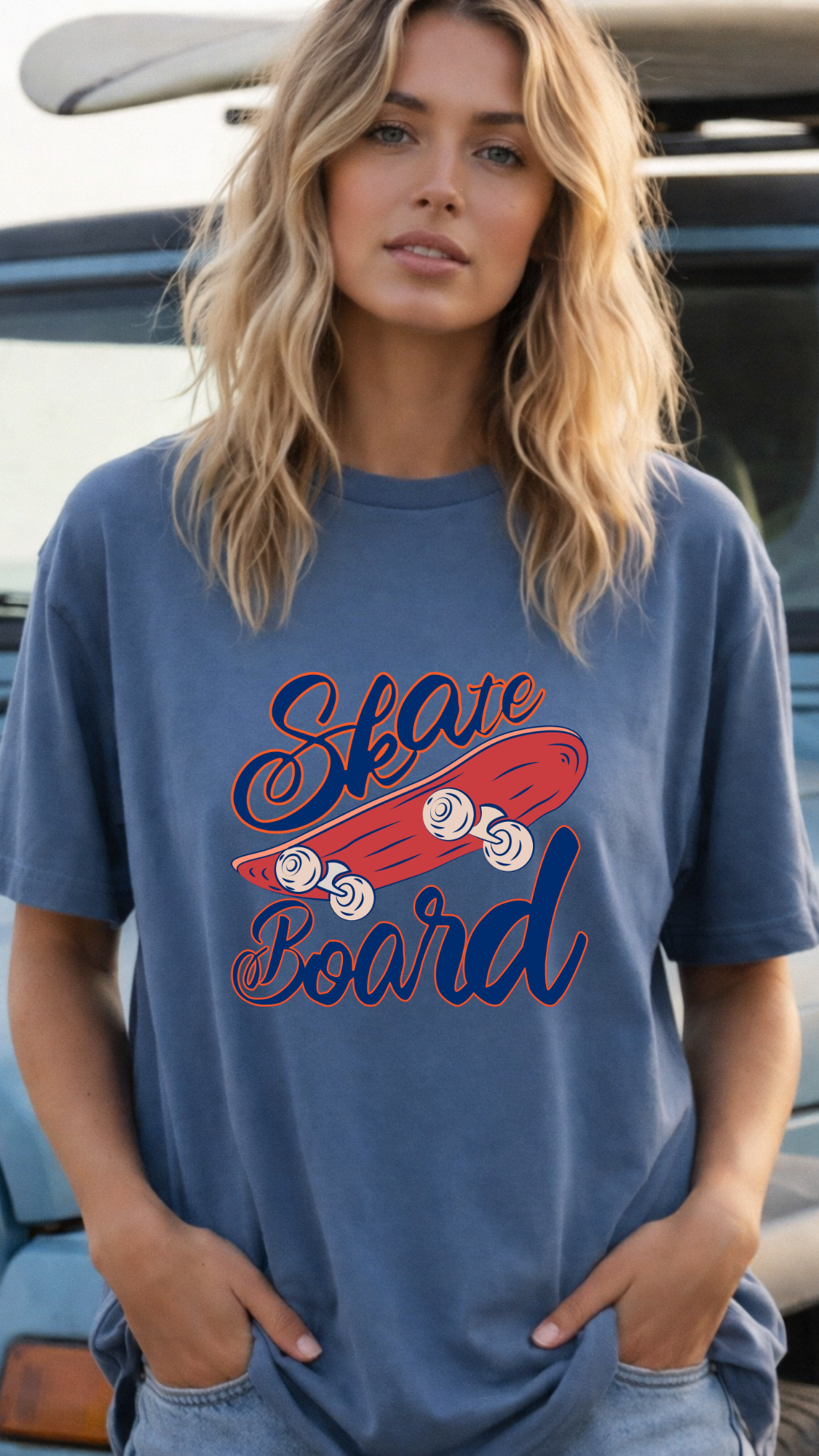 Woman wearing a blue t-shirt with a graphic design of a skateboard and text.
