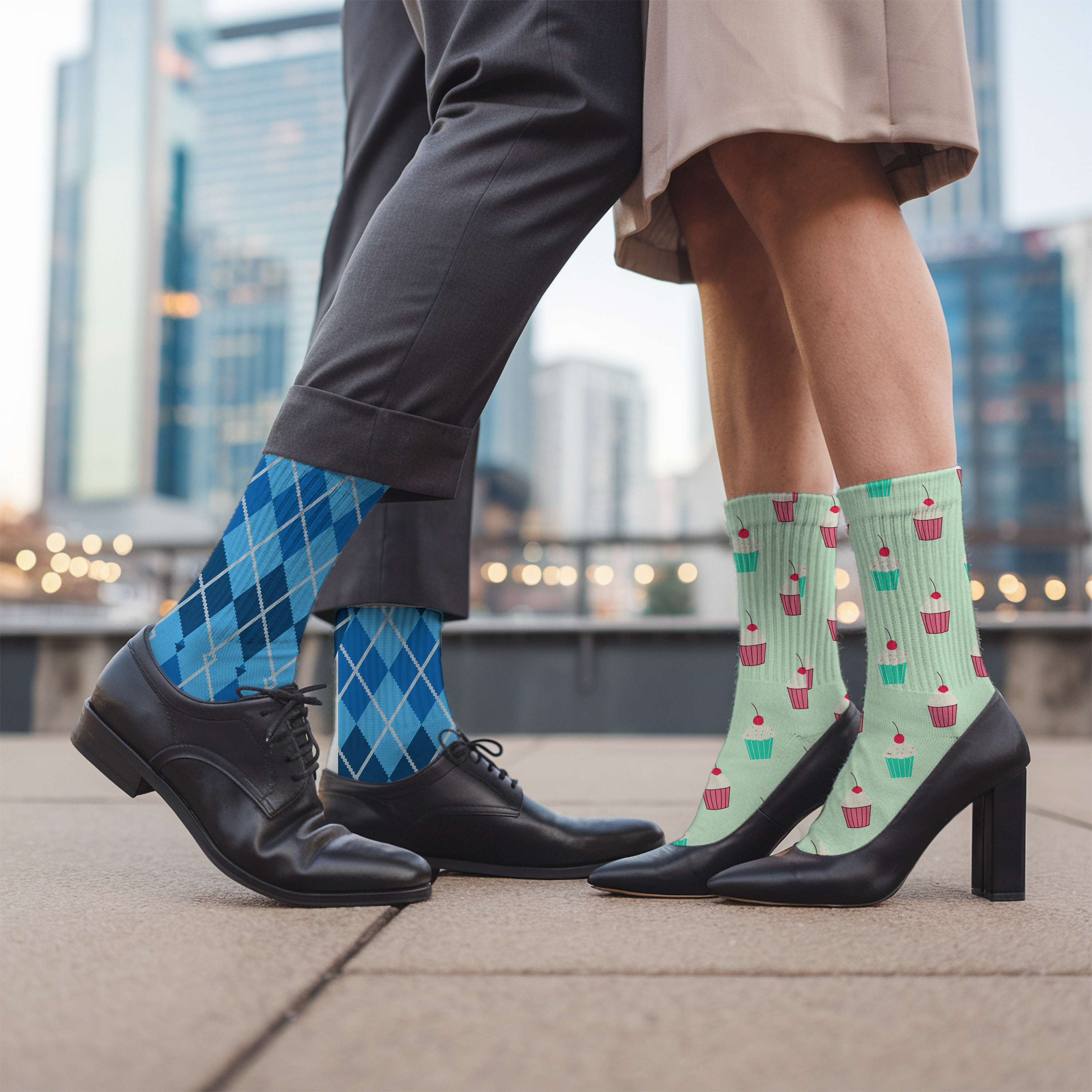 Two people wearing colorful socks with a cityscape background
