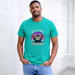 Man wearing a teal t-shirt with a raccoon graphic and text against a white wall.