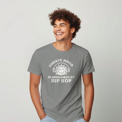 Man wearing a gray t-shirt with a humorous text design on a plain background