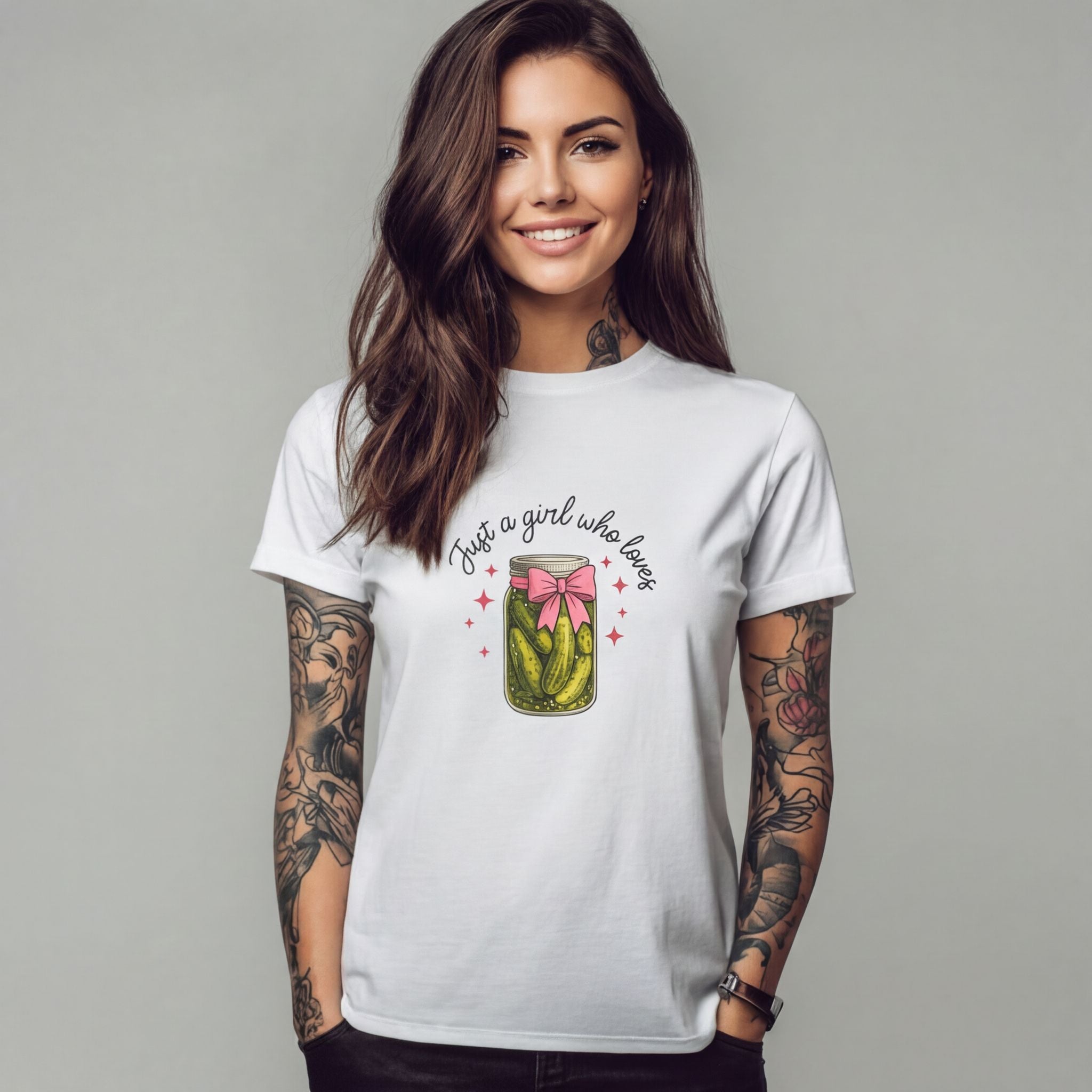 Woman wearing a white t-shirt with a graphic design on a gray background