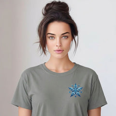 Woman wearing a gray t-shirt with a blue starfish design on a plain background
