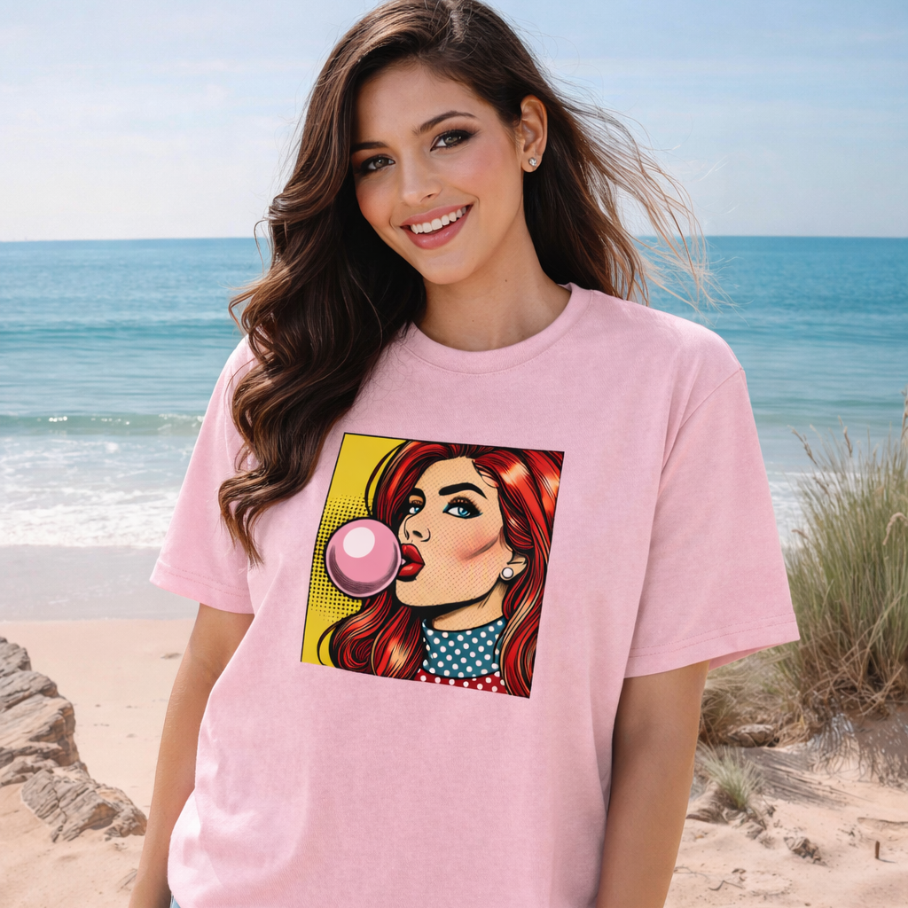 Woman wearing a pink pop art t-shirt with a graphic design on a beach