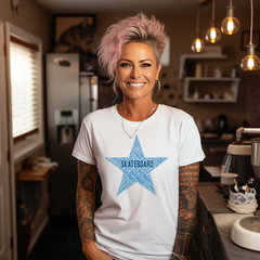 Person wearing a white t-shirt with a blue star skateboard graphic in a kitchen