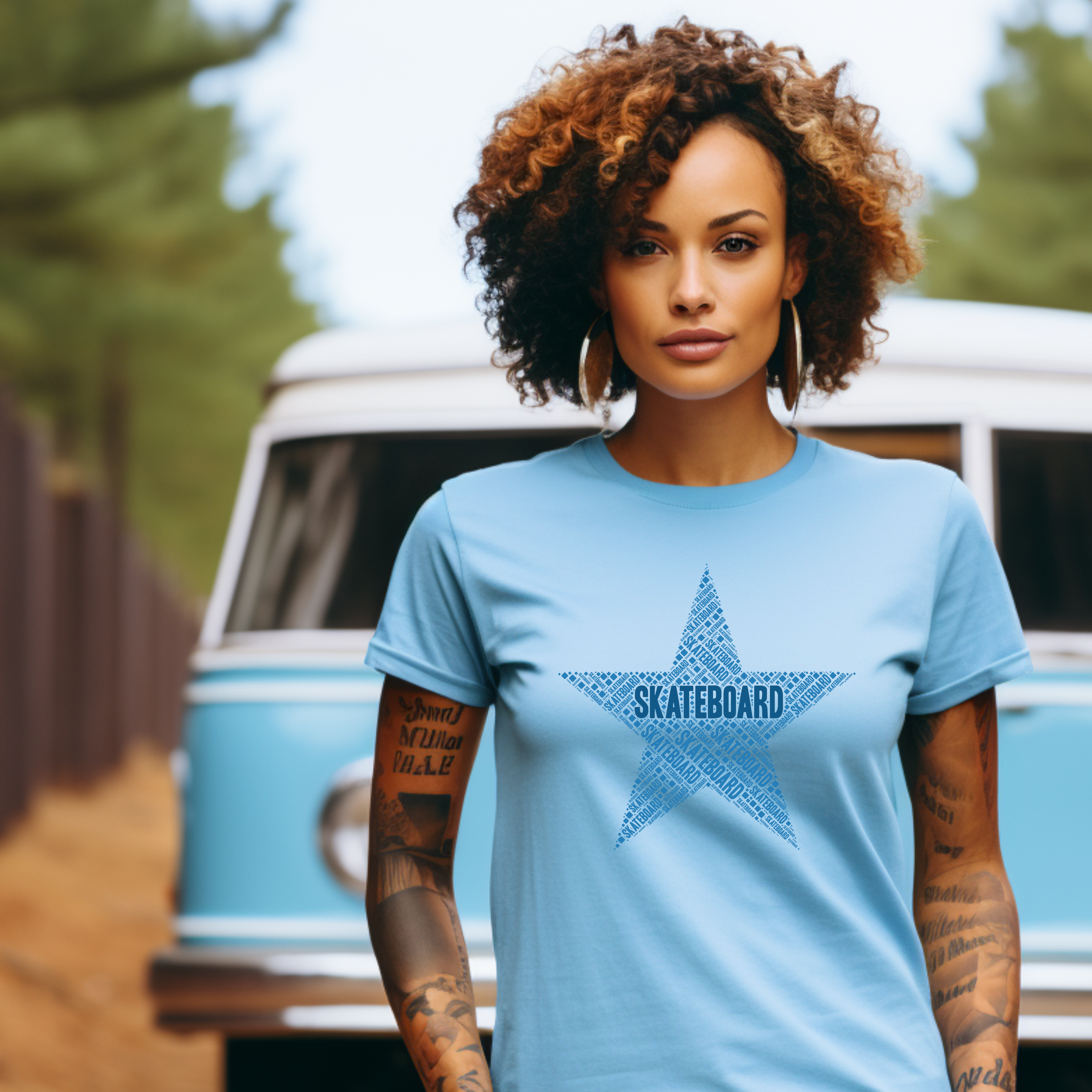 Woman wearing a light blue t-shirt with a star design and 'SKATEBOARD' text, standing in front of a vintage van.