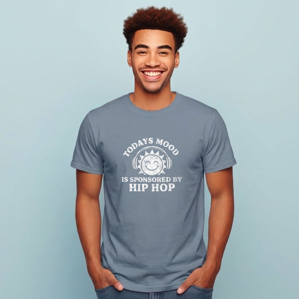 Man wearing a gray t-shirt with a humorous text design on a light blue background