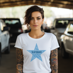 Woman wearing a white skateboard t-shirt with a blue star design in a parking garage.